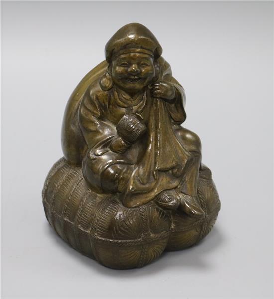 A brass seated Japanese figure of Daikoku holding mallet height 15.5cm